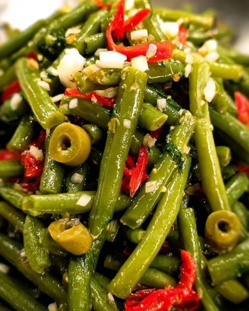 Fresh cold green bean salad with vibrant vegetables and dressing