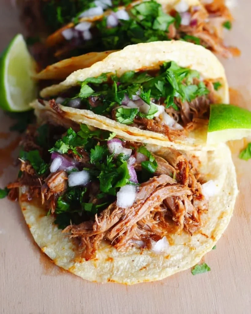 Delicious pork tacos served with fresh toppings and salsa